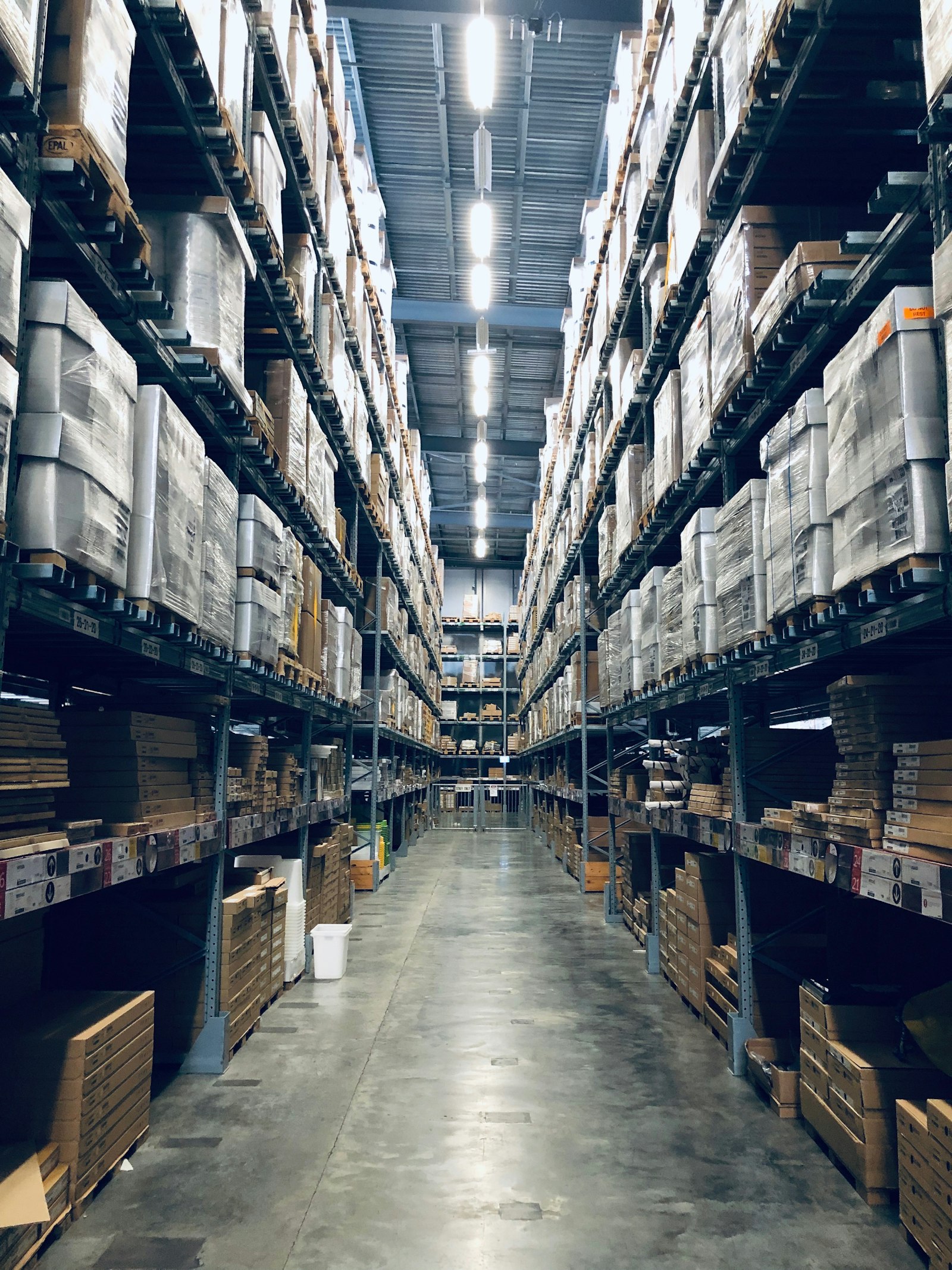 Rows of stocked warehouse shelving