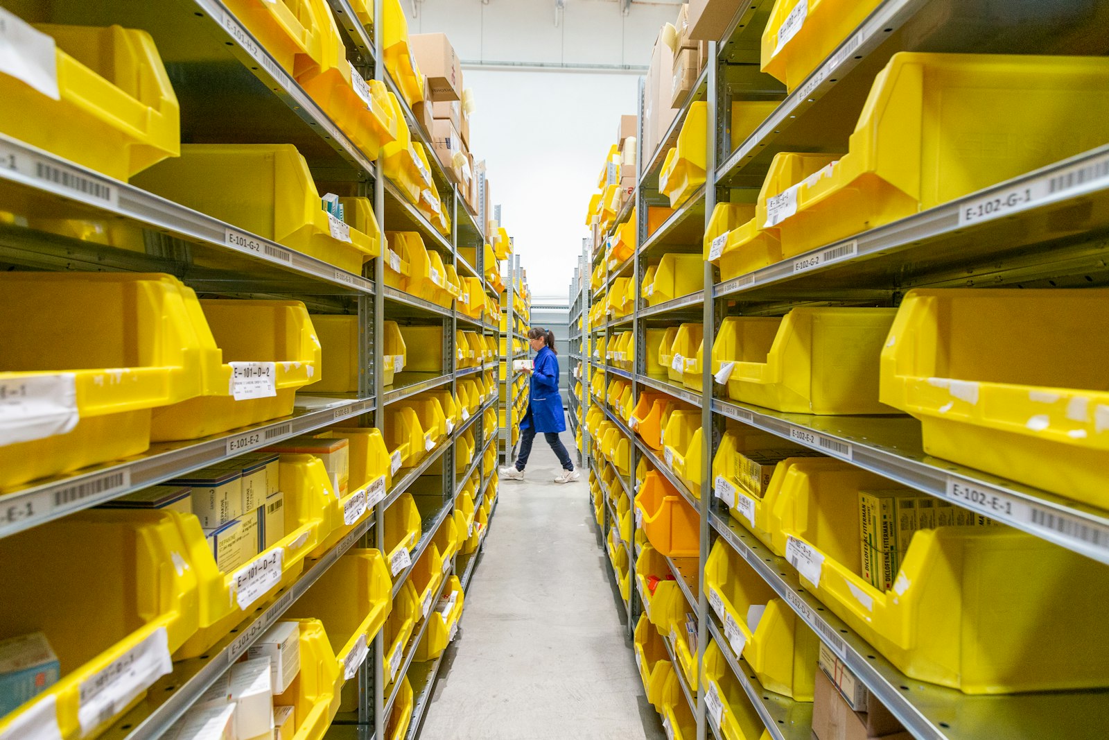 Warehouse worker picking stock from shelving